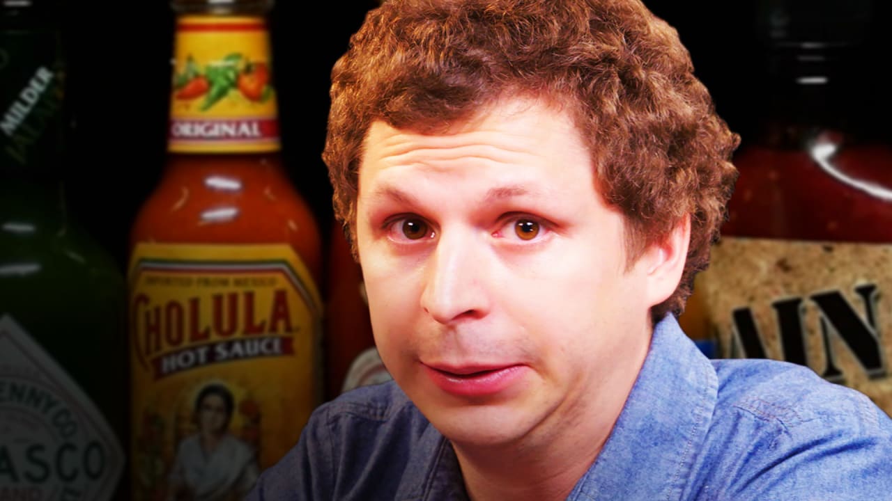 Michael Cera takes on the Hot Ones challenge with host Sean Evans. 