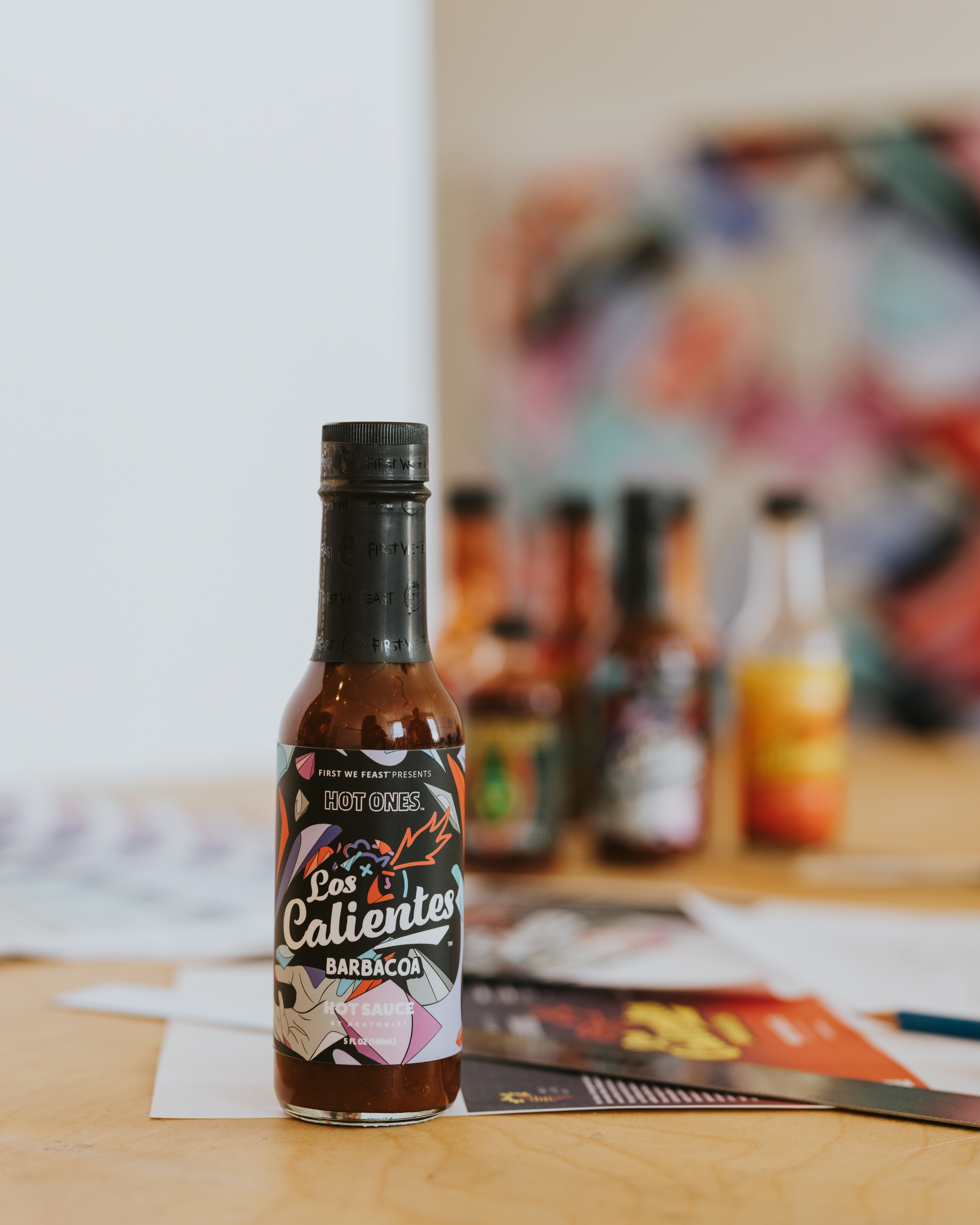 win-a-louis-de-guzman-designed-bottle-of-hot-ones-los-calientes